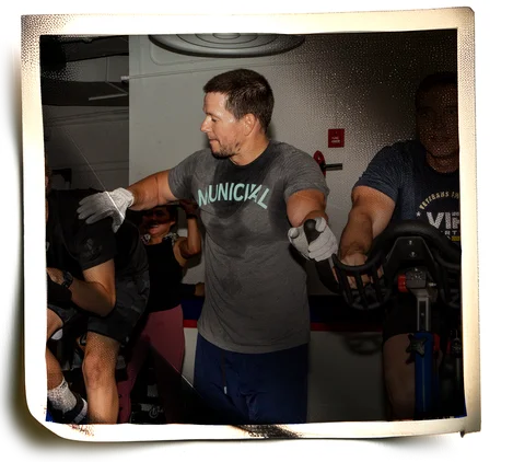 Photo montage of Hollywood actor Mark Wahlberg at an F45 gym at Marine Corps Air Station Miramar (Photo by Sgt. Jorge Rosales via Defense Visual Information Service)